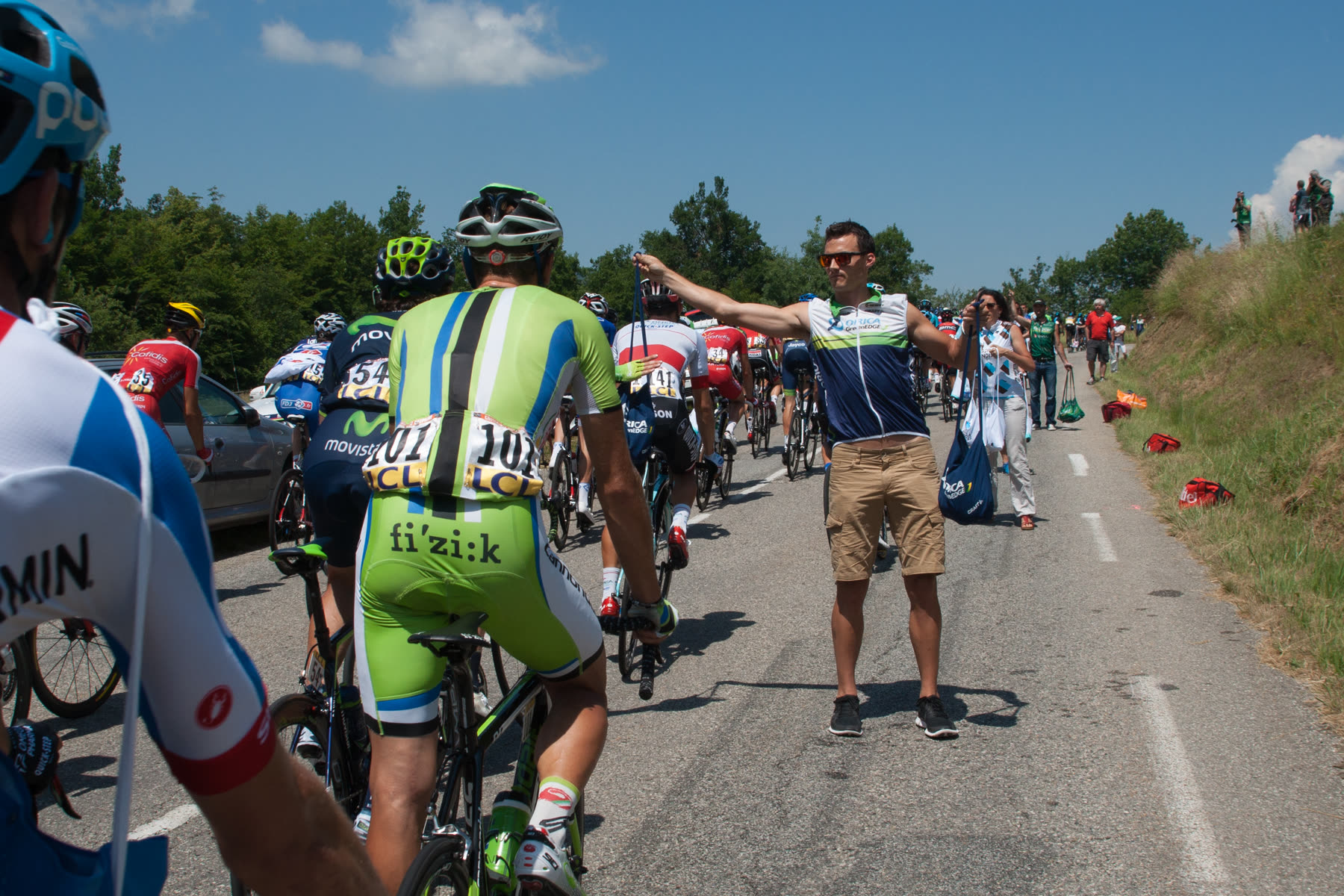 Tour Auvergne-Rhône-Alpes 2026: The peloton at the feed zone during stage 6 of the 2014 Critérium du Dauphiné.